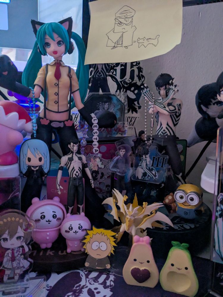 various little doodads of differing characters; including Hatsune Miku, the Demi-fiend, MEIKO, Chiikawa, Nemissa, Minion 😭, Tweek, and Ultra Necrozma!!