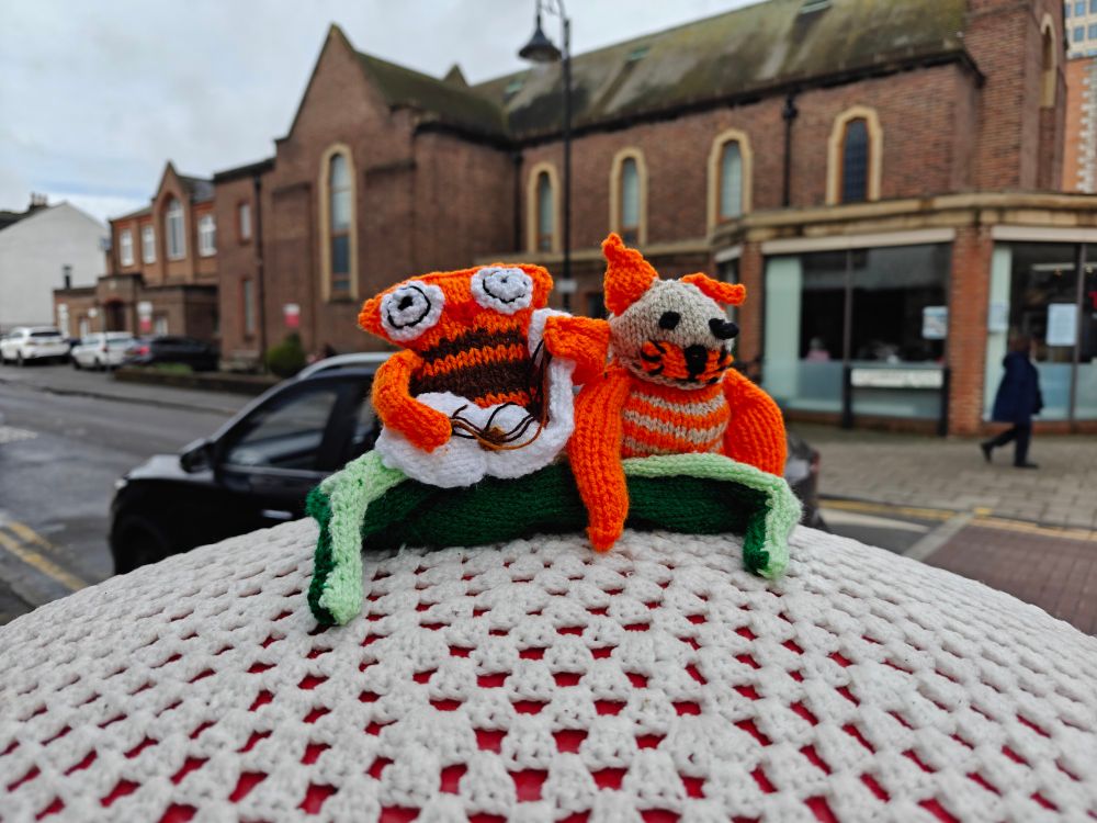 Post box topper of two eldritch creatures