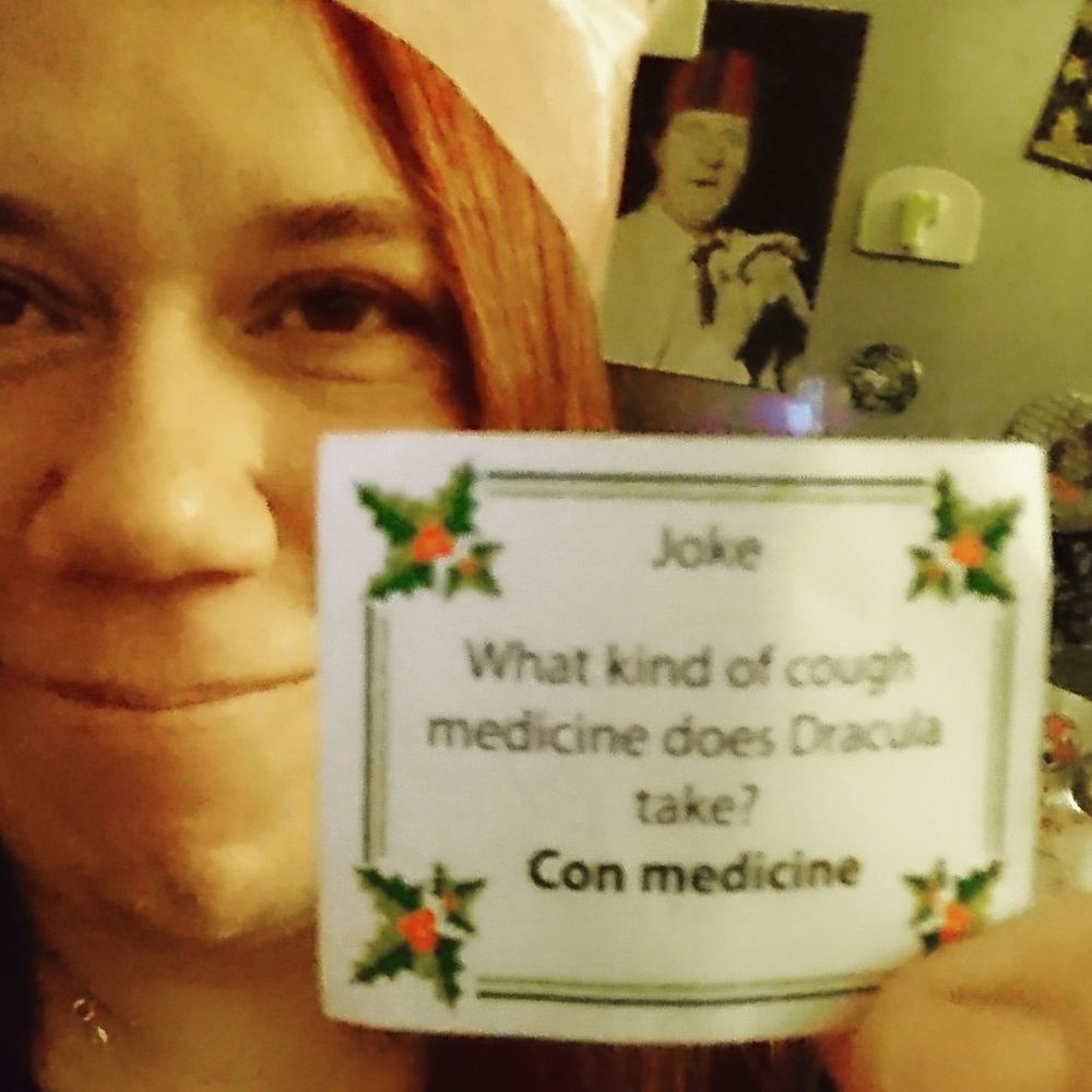 Photo of a person in a paper Christmas party hat holding up a cracker joke which reads "What kind of cough medicine does Dracula take? 
Con medicine"

Turns out that "ffi" is a special character in some fonts and when the typeface is changed to one that doesn't have it, those letters don't get printed, so Coffin Medicine became Con Medicine.