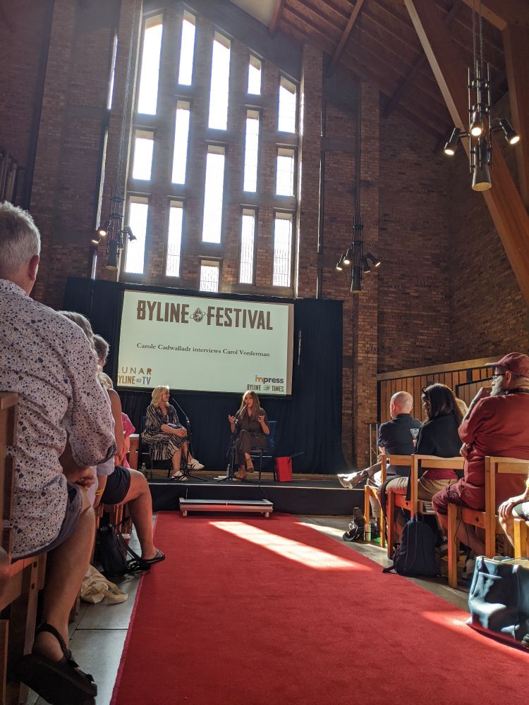 photo of Byline Festival event in the Chapel at Keele university where Carole Cadwalladr interviewing Carol Vorderman