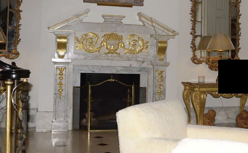 close-up of Jeffrey Epstein's ornate gilded fireplace 