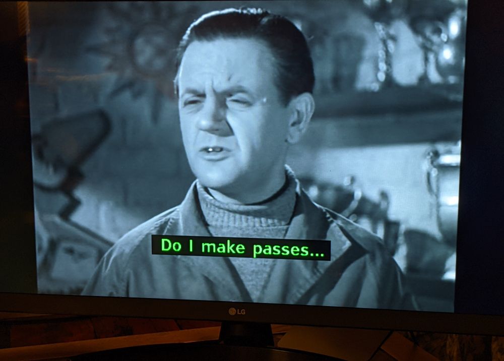 The ghost in Dead of Night. The subtitle says "Do I make passes..."