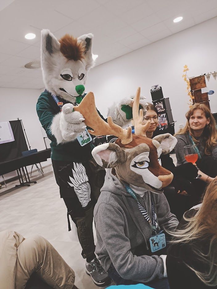 Same as previous pic, now the wolf is touching the antlers in a different spot.