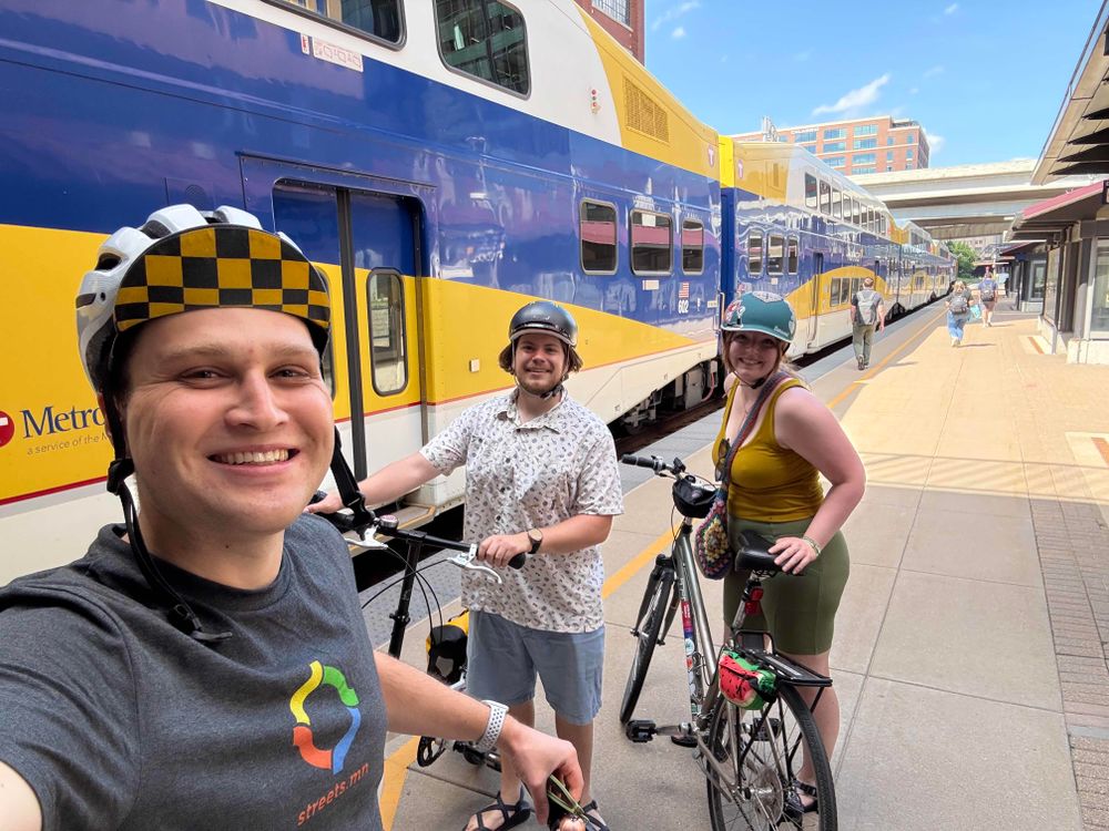 Selfie of Brian, Parker, and Jenn with their bikes at the Target Field Northstar station in downtown Minneapolis