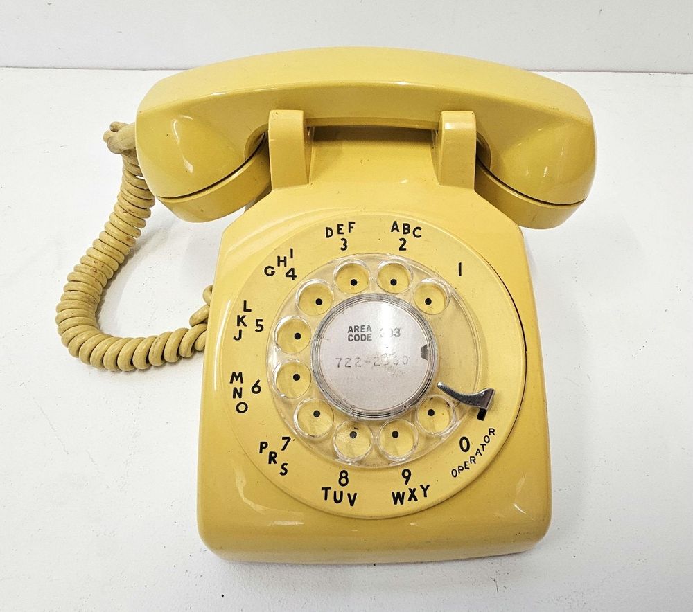 yellow rotary phone. almost identical to the one we had growing up.