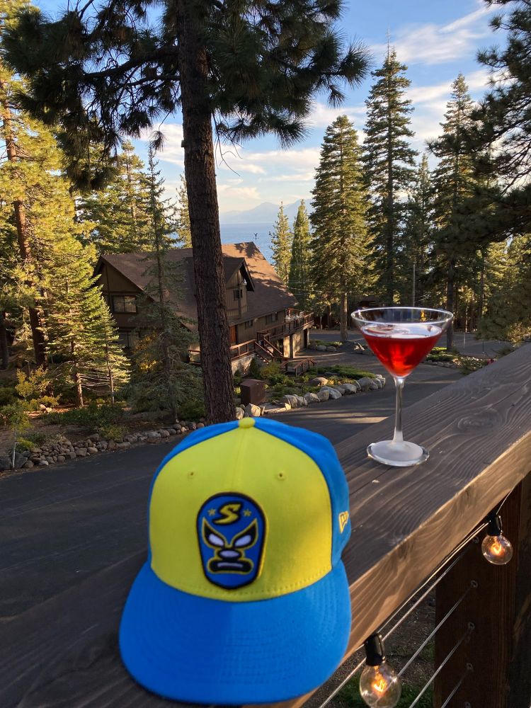 Sacramento Dorados cap and a Negroni on a deck