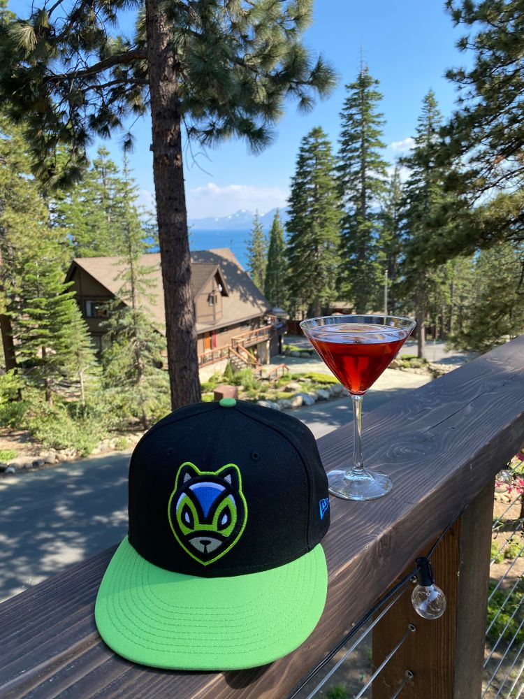 Ardillas Voladoras cap and a delicious Negroni in front of Lake Tahoe