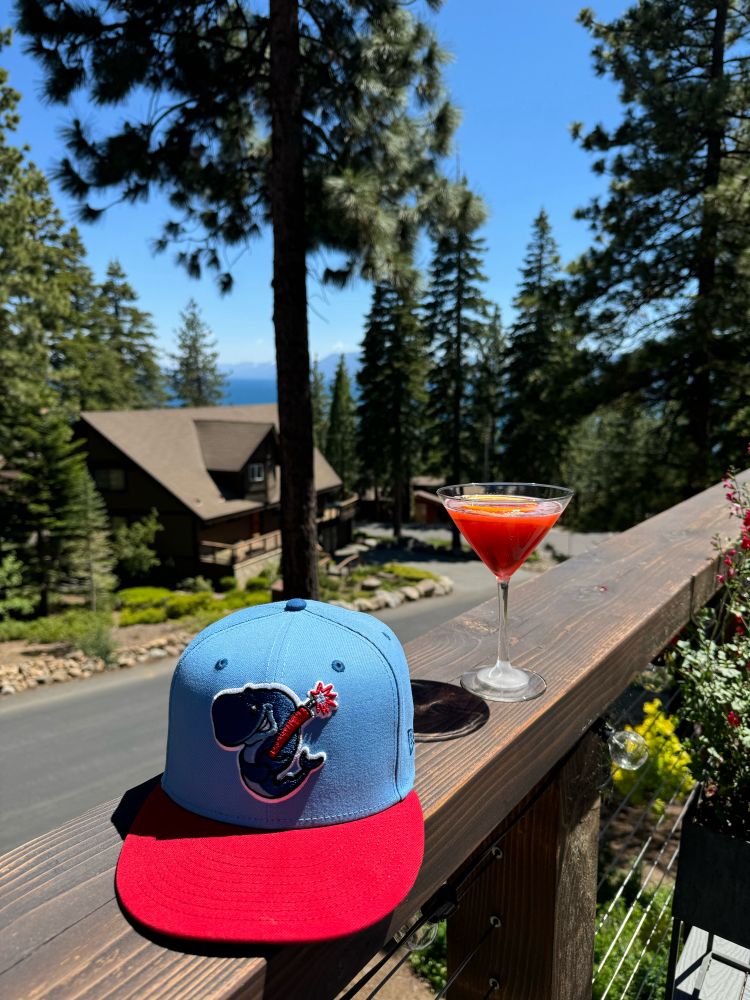 Eugene Exploding Whales hat and a Negroni on a deck overlooking Dollar Point