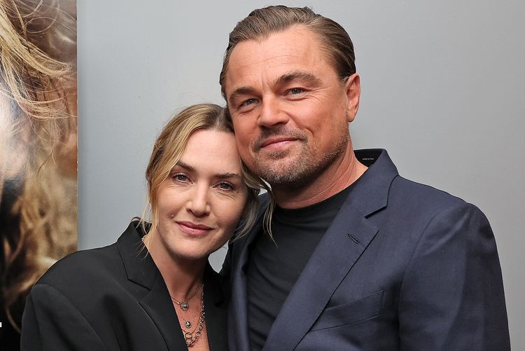 A recent picture of Kate Winslet and Leonardo DiCaprio at some Titanic reunion or another. She leans at him and they look *exactly* like an English teacher about to get married to the gym teacher.