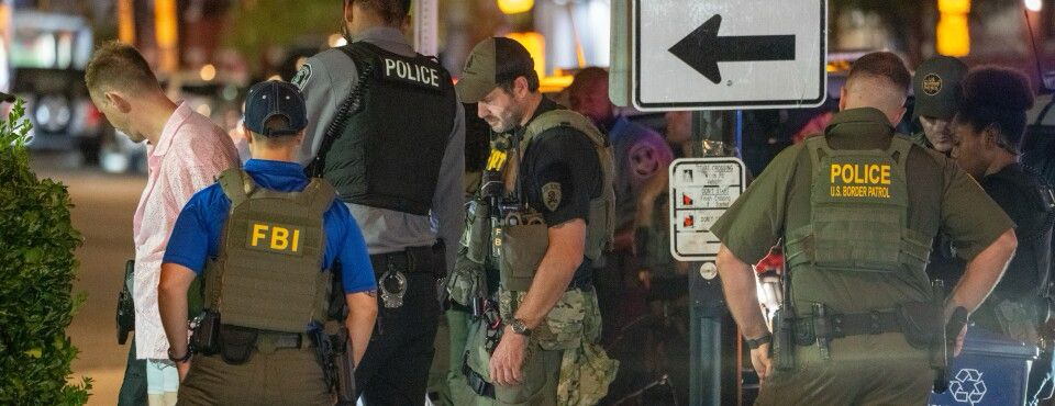 The man charged with assault for throwing a sandwich at a federal officer in Washington worked for the Justice Department and has been fired, Attorney General Pam Bondi announced.