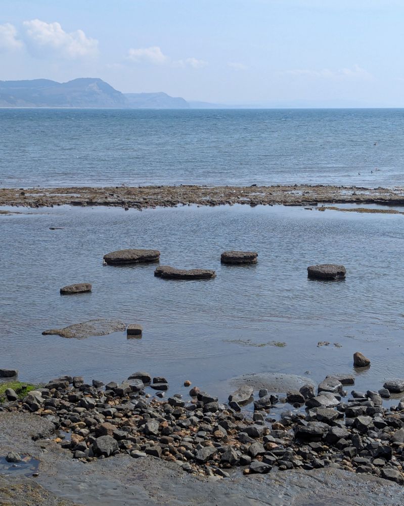 Low tide revealing shale ledges at the Jurassic Coast in Lyme Regis, Devon, UK.
