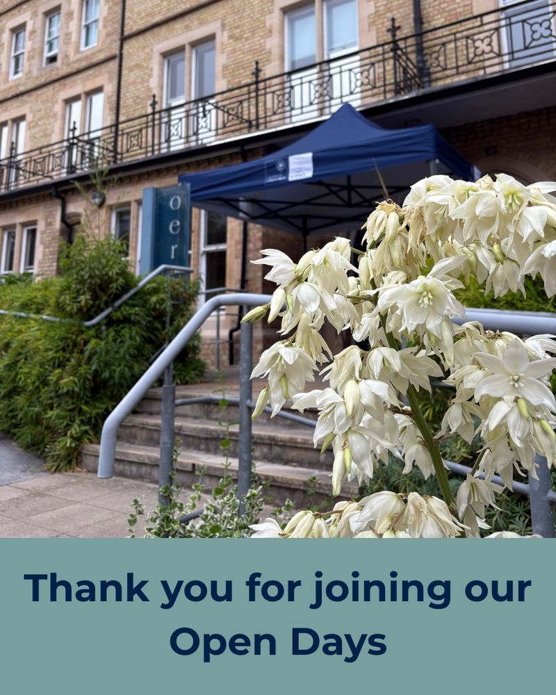 A photograph of a beige building with beautiful white flowers in front of it and a blue gazebo on the top of the steps by the building. Beneath the image there is a block of text reading ‘Thank you for joining our Open Days’ with a green-grey background.