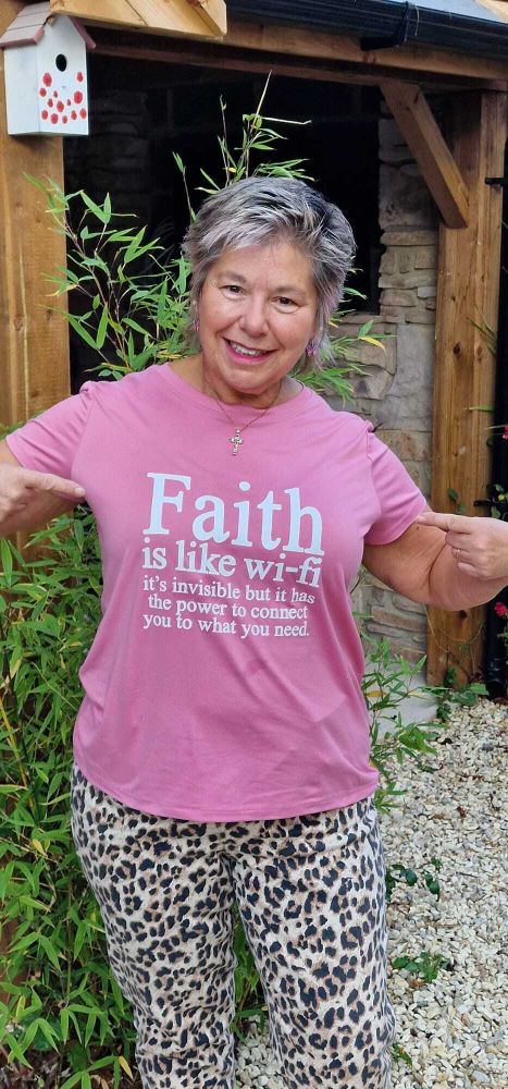 Steph wearing a t-shirt, saying 'Faith is like wi-fi - it's invisible but it has the power to connect you to what you need'.