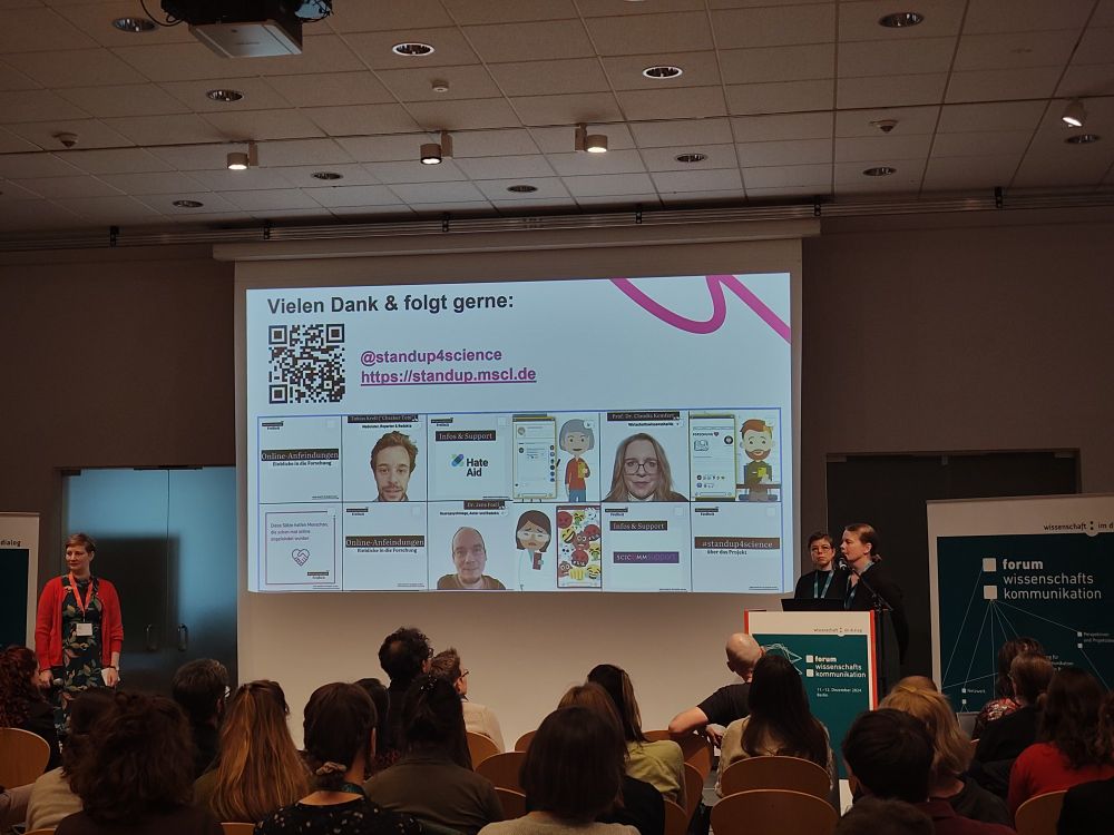 Foto der beiden Vortragenden und eine Slide, die auf standup.mscl.de verweist.