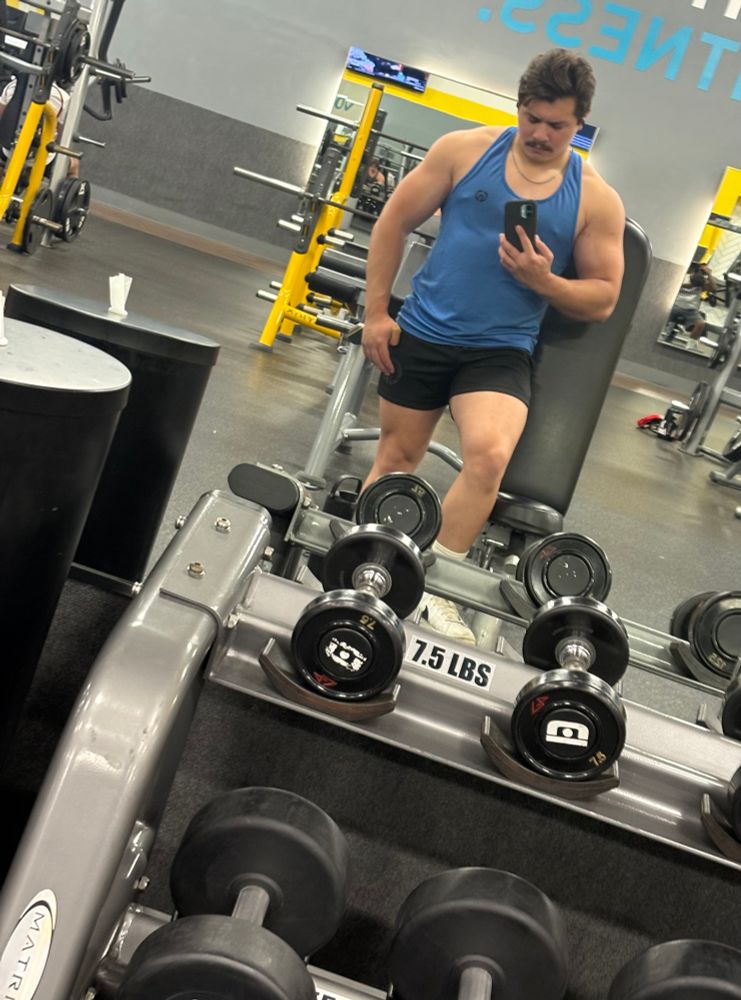 Small guy staring in the mirror 