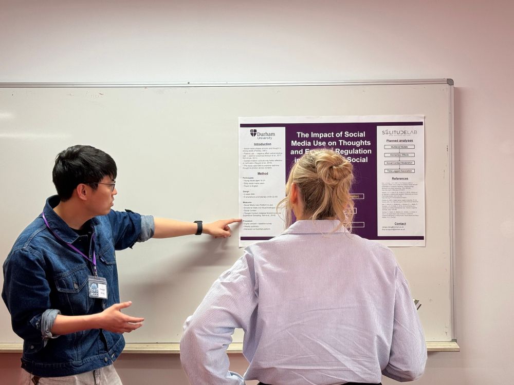 Xiangyu Deng presenting his poster