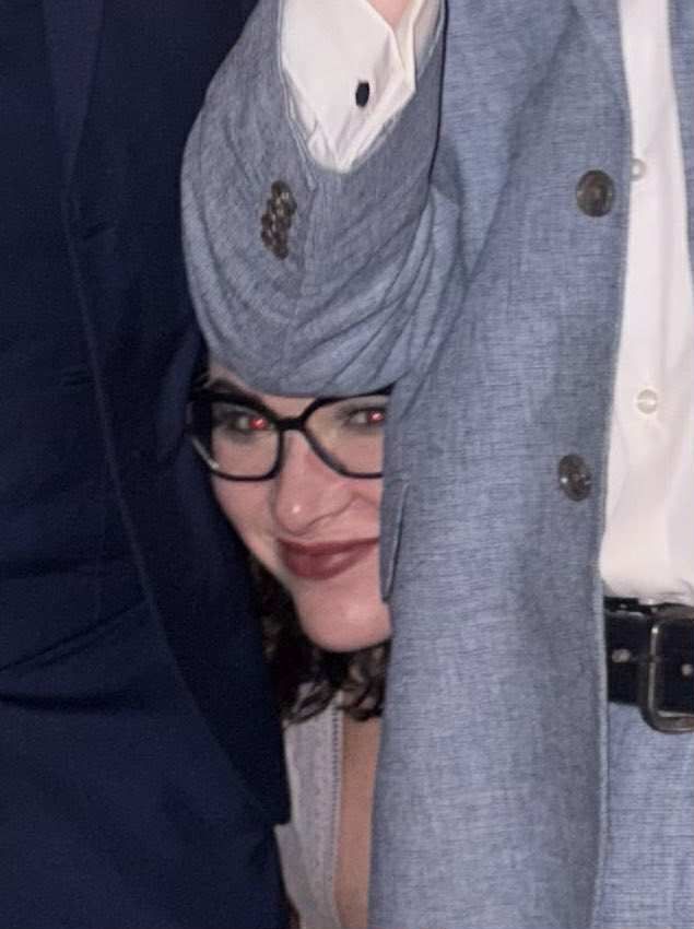 my face peering out between two dudes in suits