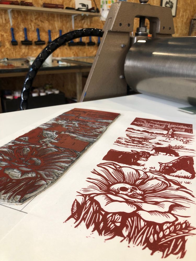 Linocut illustration for a folk horror themed TTRPG on an etching press in Hello Print studio. 