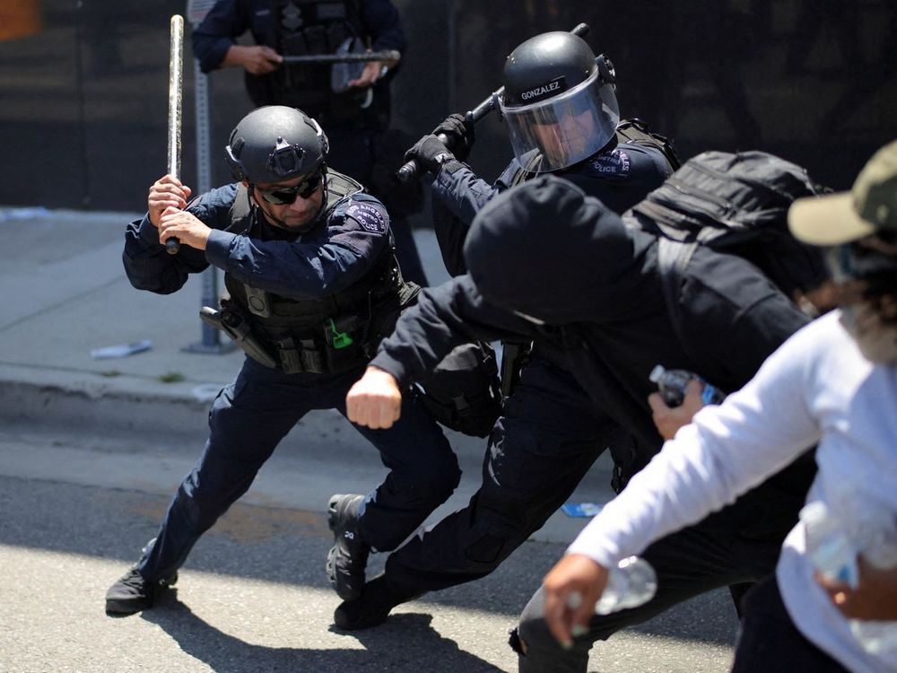 Security forces fire tear gas, rubber bullets in downtown Los Angeles as protesters continue to rally for a third day.