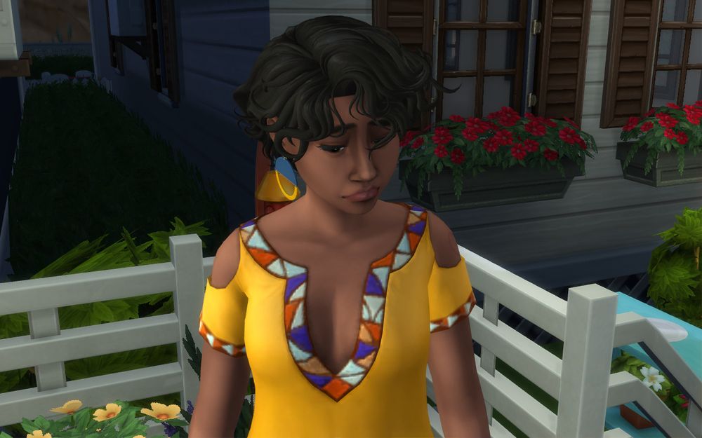 Eva sadly glances down at the ground after she gets the bad news. 