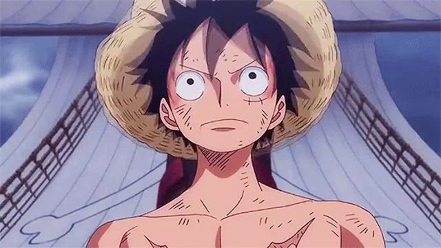 monkey d luffy from one piece is wearing a straw hat and a shirtless body .