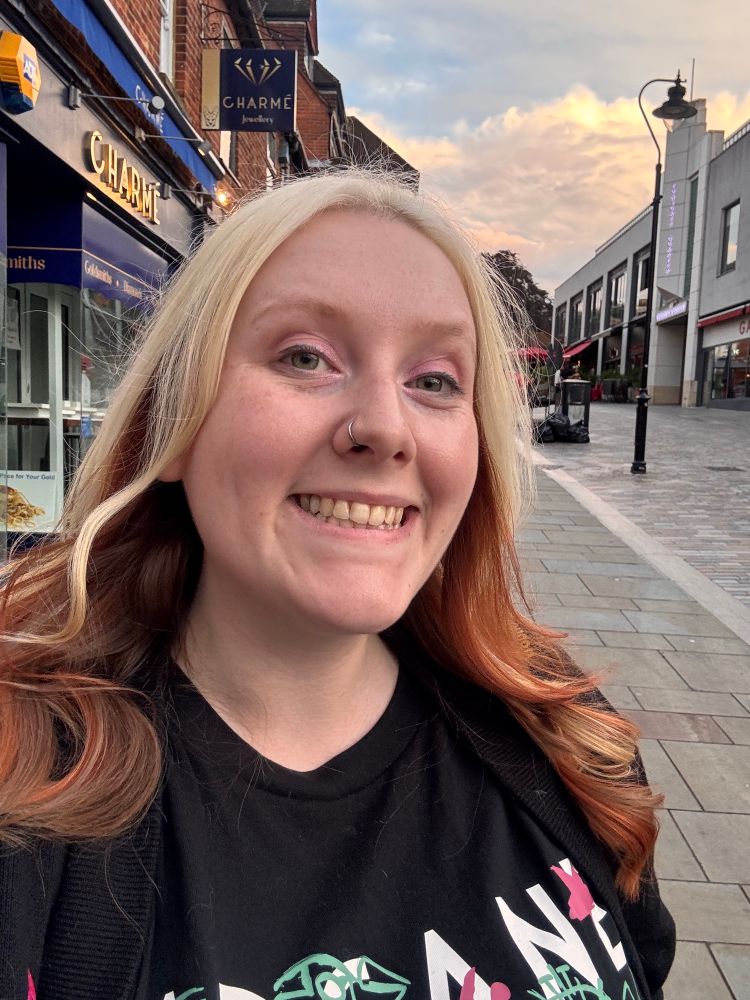 Image is of me smiling into the camera with freshly dyed hair. It’s a mixture of blonde and ginger 
