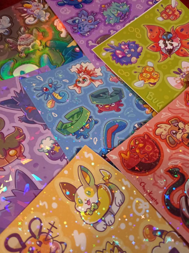 Different sparkly sticker sheets of different types of pokemon 