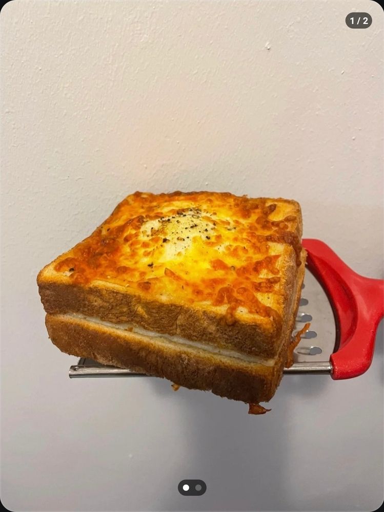  grilled cheese topped with browned cheese