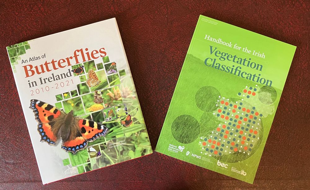 Two books on a table. An atlas of butterflies in Ireland and Handbook for the Irish vegetation classification 