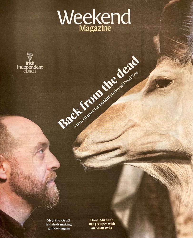 Bearded man on left, face to face with a Kudu antelope 