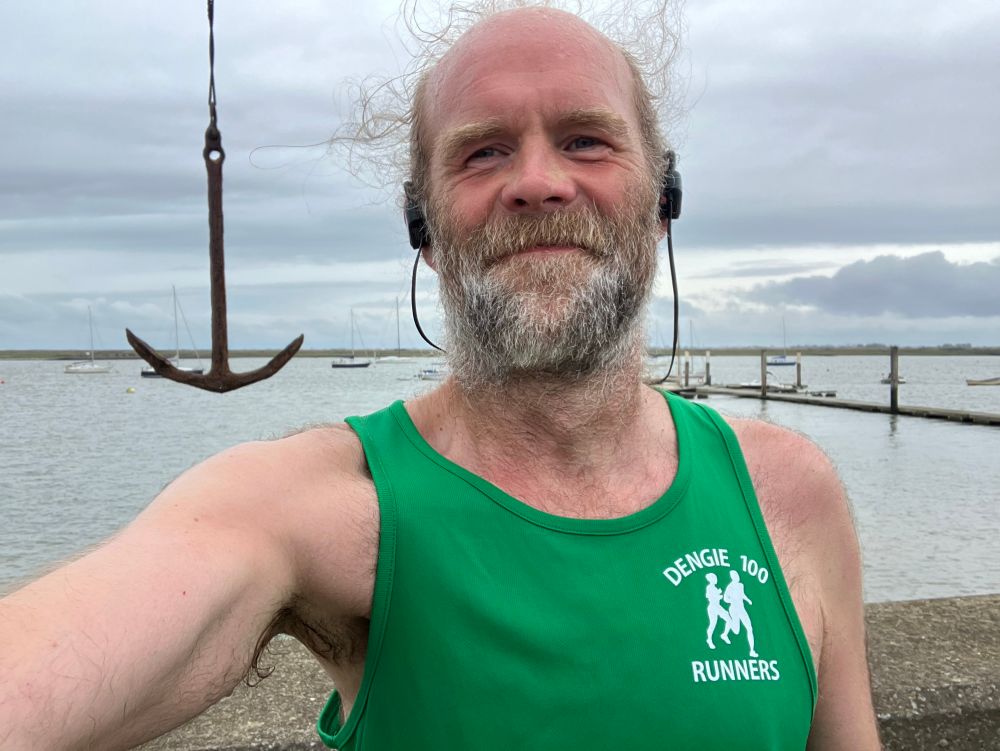 Sweaty runner in green with an anchor in the background (insert your joke of choice here)