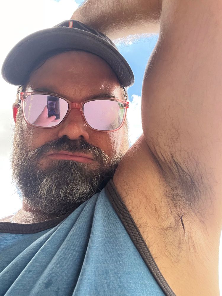 A selfie of a man and his armpit. 
