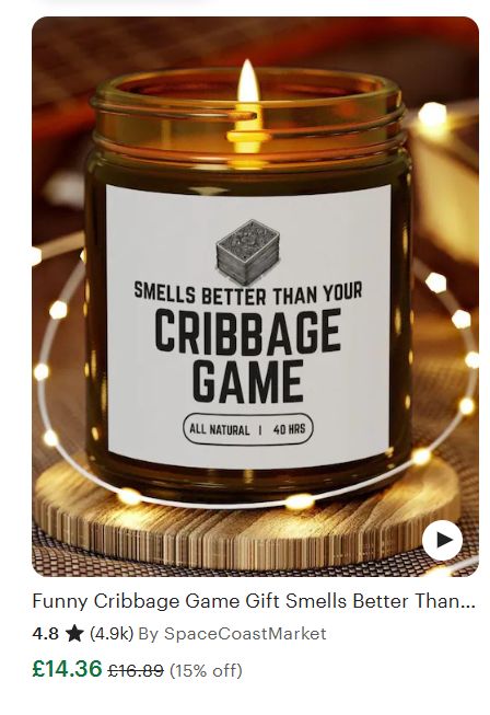 A sented candle reading "smells better than your cribbage game"