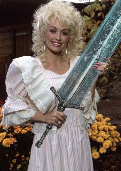Dolly Parton holding Holy Moonlight