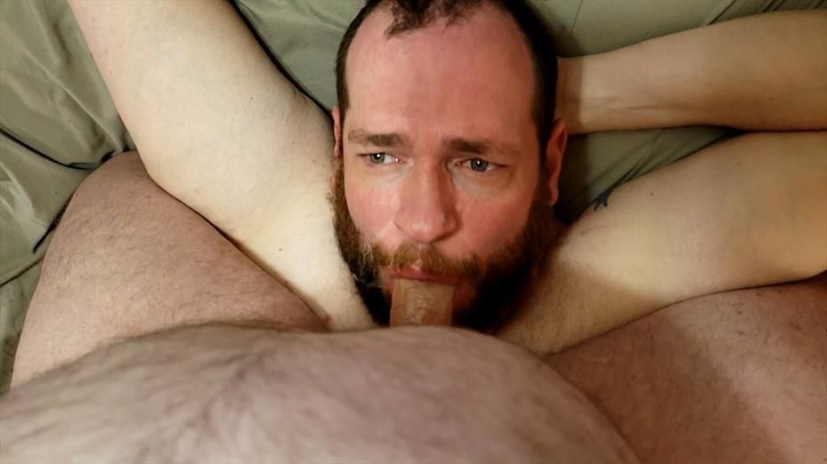 A bear straddling socknjock, pinning him down and fucking his face