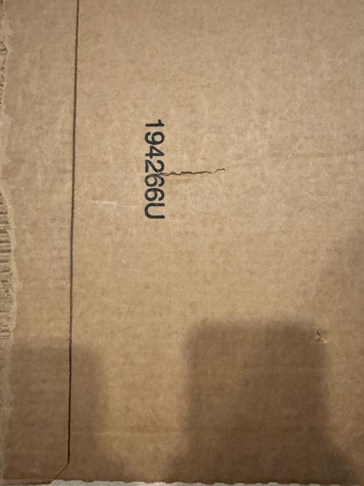 Shipping box for vinyl albums with visible dent in the center 
