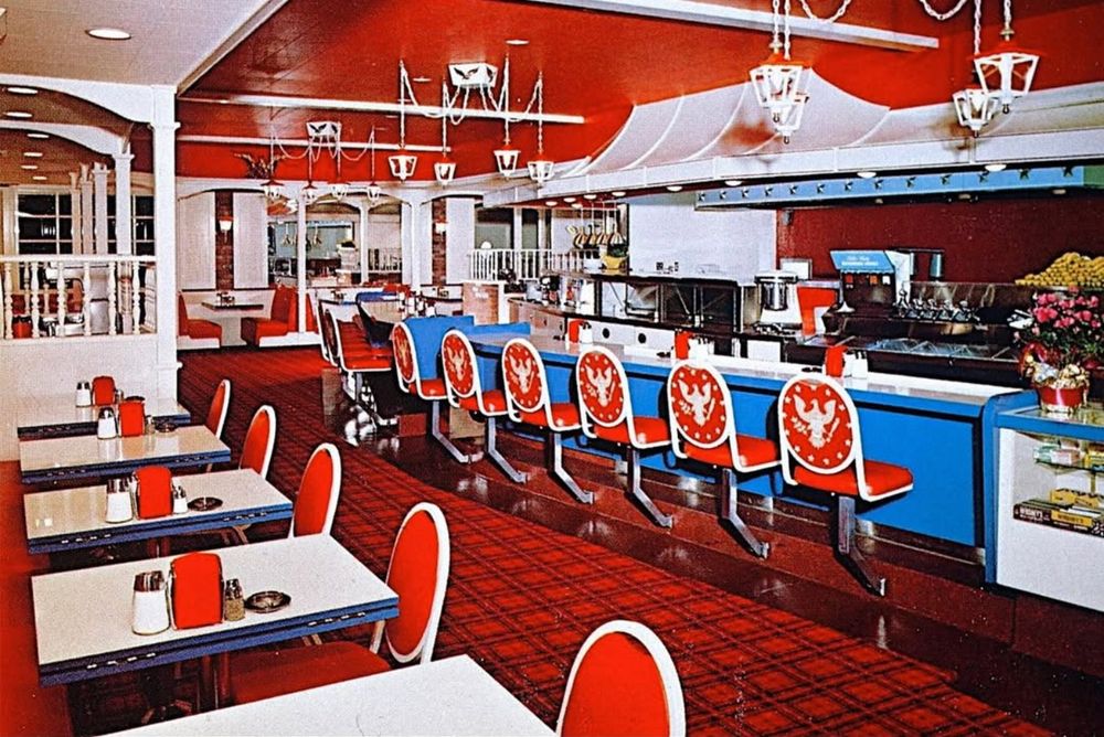 postcard photo of the Betsy Ross Coffee Shop, everything is red, white, and blue, with eagles on the back of the seats