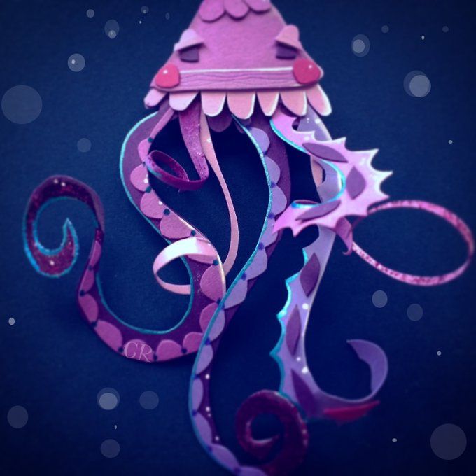 cut paper art of a purple jellyfish under the sea