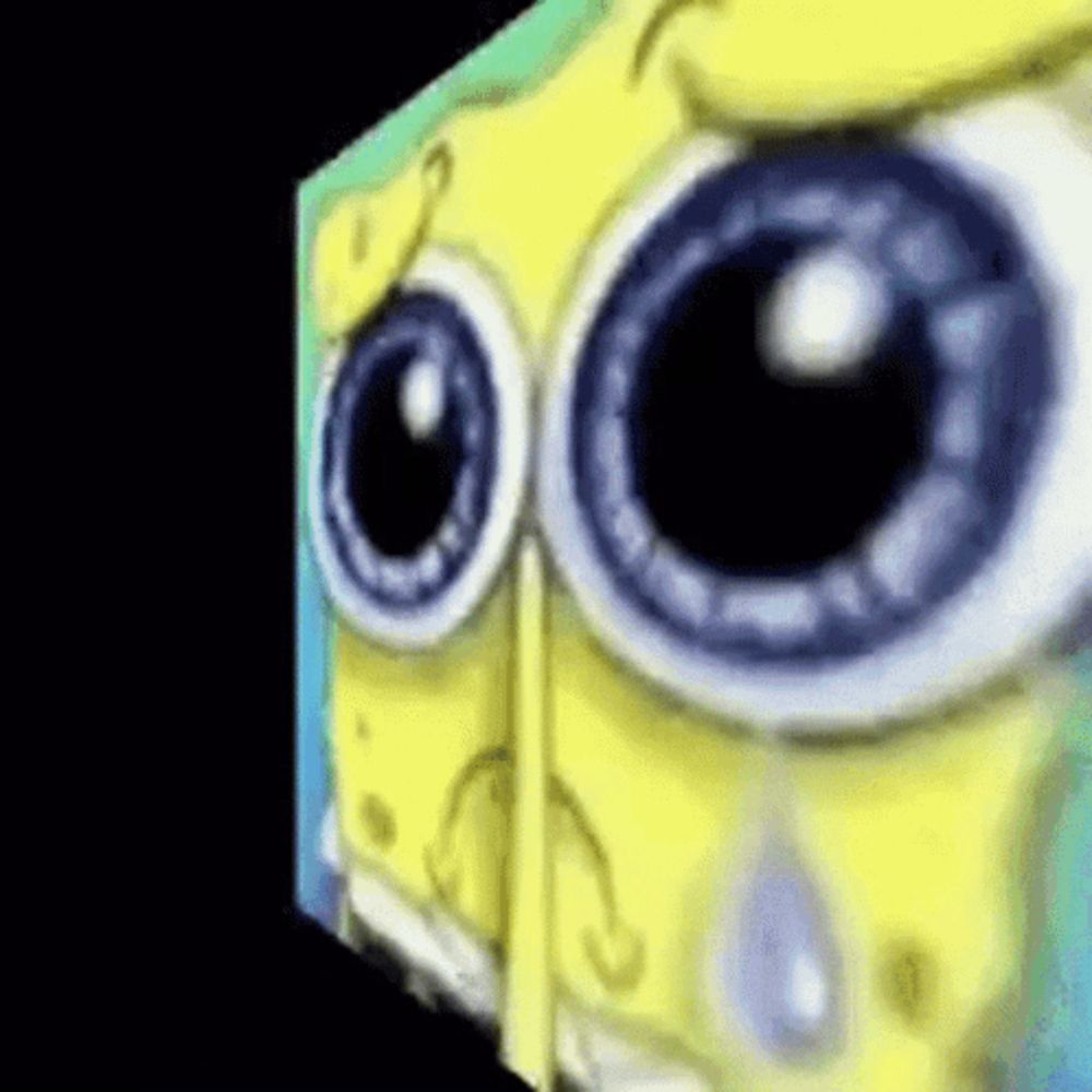 a close up of spongebob squarepants ' eyes with a tear coming out of his eye .