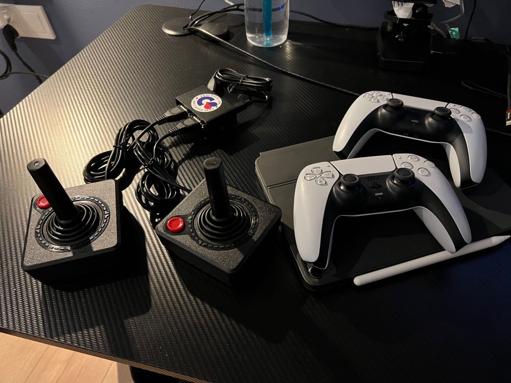 Two Atari joysticks and their usb adapter