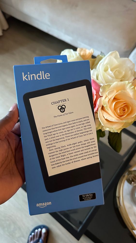 Amazon kindle displayed with roses acting as a backdrop 