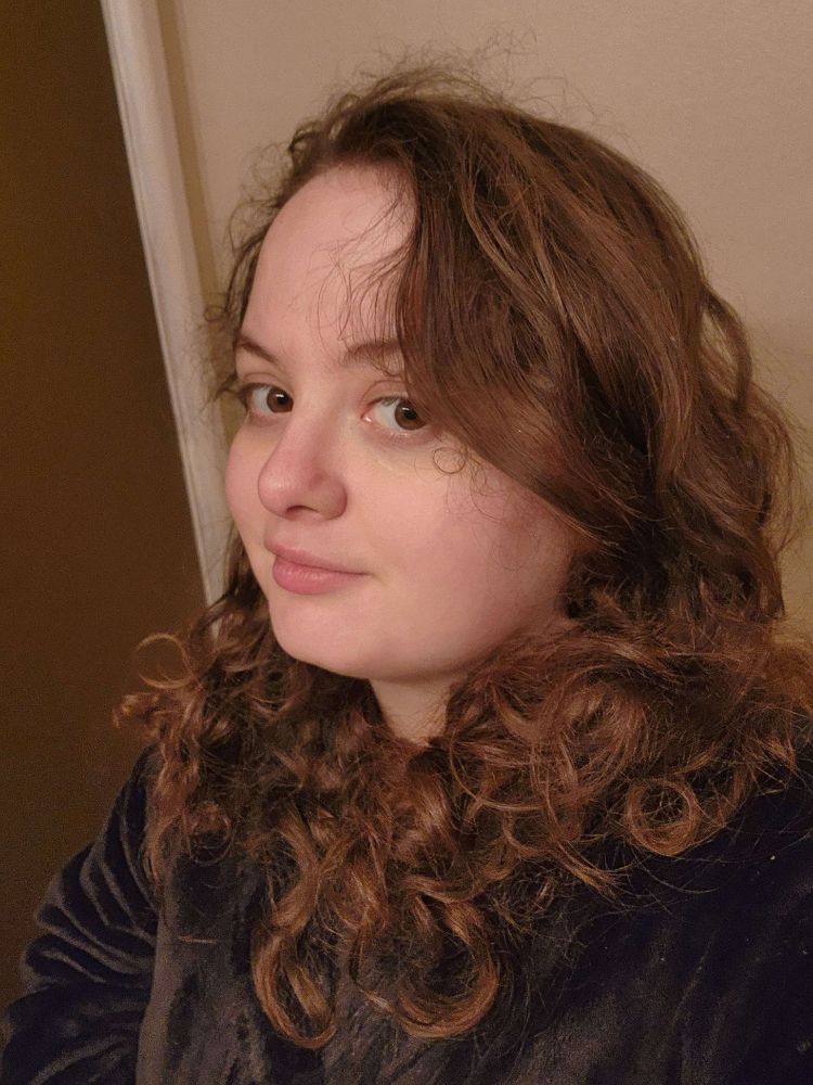 Me and my curly hair. wearing a comfy jacket.
