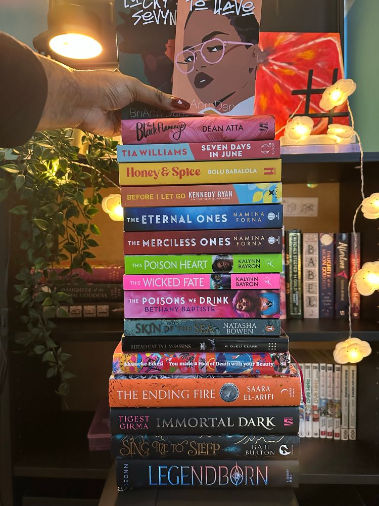 Tower of books written by black people:

Legendborn by Tracy Deonn
Sing me to Sleep by Gabi Burton 
Immortal Dark by Tigest Girma 
The Ending Fire by Saara El-Arifi 
You made a fool of death with your beauty by Akwaeke Emezi 
The dead cat tail assassins by P. Djèlí Clark 
Skin of the Sea by Natasha Bowen 
The Poison we Drink by Bethany Baptiste 
This Wicked fate & This Poison Heart by Kaylynn Bayron 
The Merciless Ones & The Eternal Ones by Namina Forna
Before I let go by Kennedy Ryan 
Honey & Spice by Bolu Babalola 
Seven days in June by Tia Williams 
The Black Flamingo by Dean Atta 
Lucky number seven & Yours to have by Anna Danae