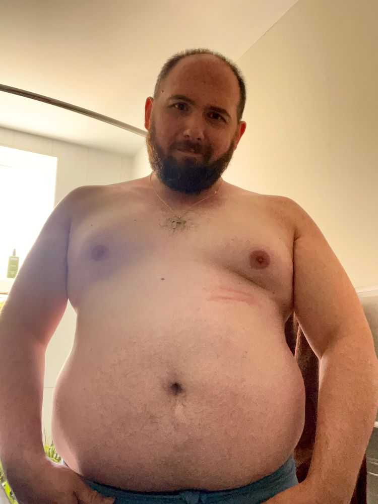 Standing shirtless 