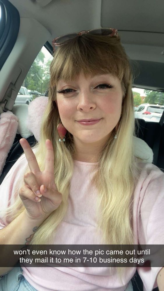 me sitting in my car giving a peace sign captioned "won't even know how the pic came out until they mail it to me in 7-10 business days"