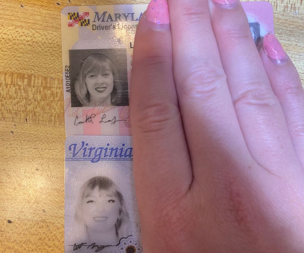 my old maryland license photo when i kind of had a fuckass bob, headband, red lipstick vs. my new virginia license that's overexposed to hell and back but you Can in fact see the eyeliner and falsies