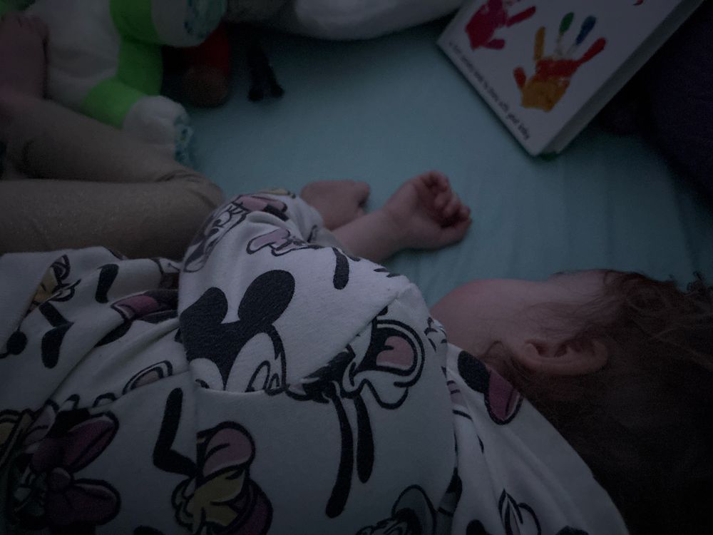 Sleeping toddler in bed 