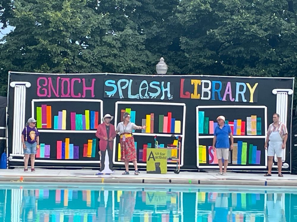 Pool with “Enoch Splash Library” backdrop. 