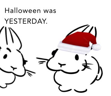 Two Slungi, one of them having a festive hat, and the other coming in with a raised eyebrow saying “Halloween was YESTERDAY.”