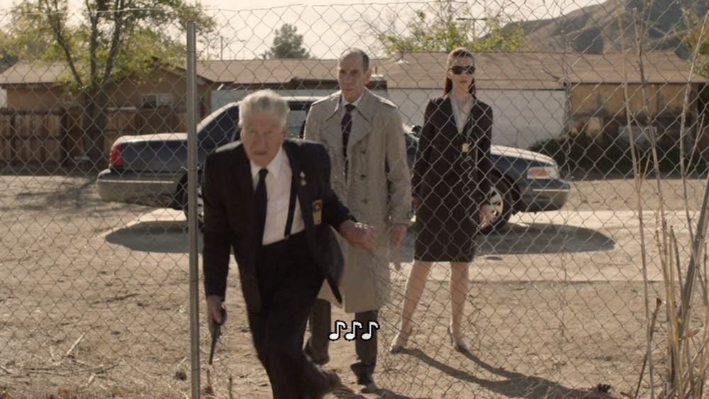 David Lynch as Gordon Cole in Twin Peaks entering a fence to investigate spooky goings-on
